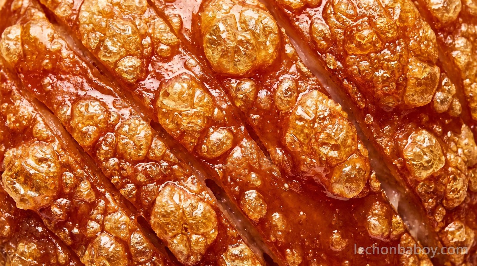 Close-up of glassy, blistered lechon crackling — the mark of a great roast